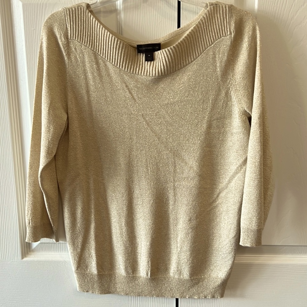 Light gold sweater with 3/4 length sleeves. Striped material around collar.